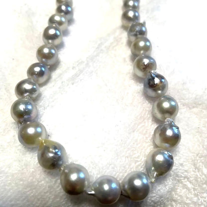 High-quality Akoya baroque pearl in blue-gray color measuring 9.5 to 9 mm with certificate