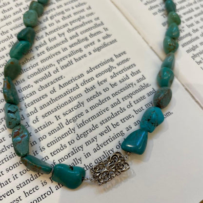 Agete necklace featuring 25 turquoise stones and 1 ruby stone with K10 gold-plated chain and openwork design