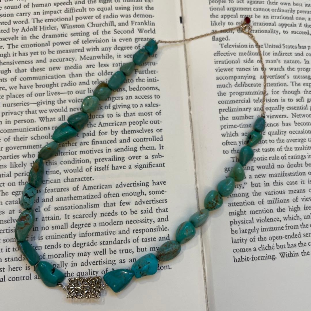 Agete necklace featuring 25 turquoise stones and 1 ruby stone with K10 gold-plated chain and openwork design