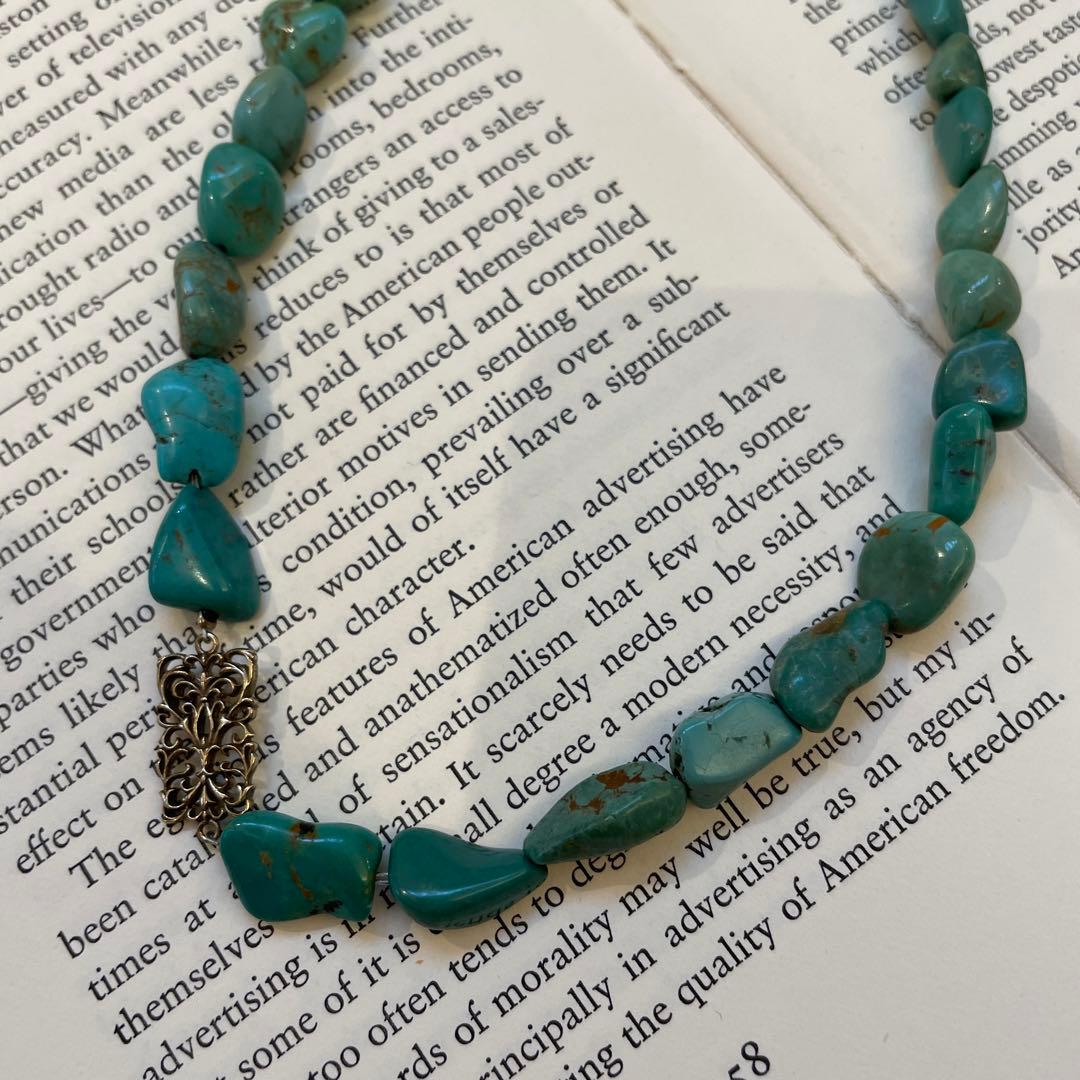 Agete necklace featuring 25 turquoise stones and 1 ruby stone with K10 gold-plated chain and openwork design
