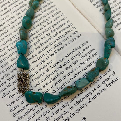 Agete necklace featuring 25 turquoise stones and 1 ruby stone with K10 gold-plated chain and openwork design