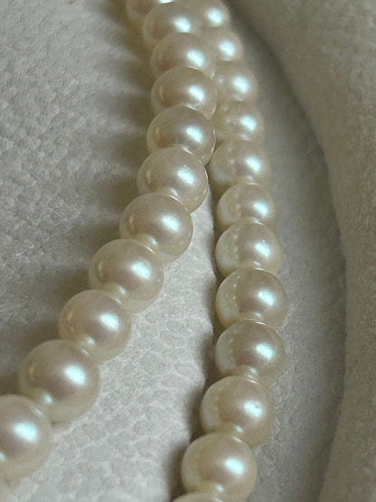 Akoya pearl gradient double necklace with silver clasp featuring white pearls ranging from 3 to 8 mm