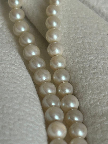 Akoya pearl gradient double necklace with silver clasp featuring white pearls ranging from 3 to 8 mm