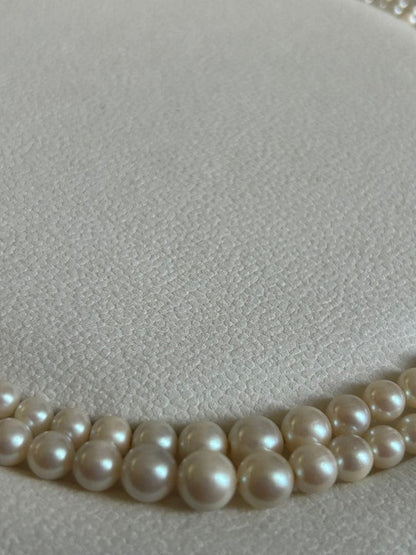 Akoya pearl gradient double necklace with silver clasp featuring white pearls ranging from 3 to 8 mm