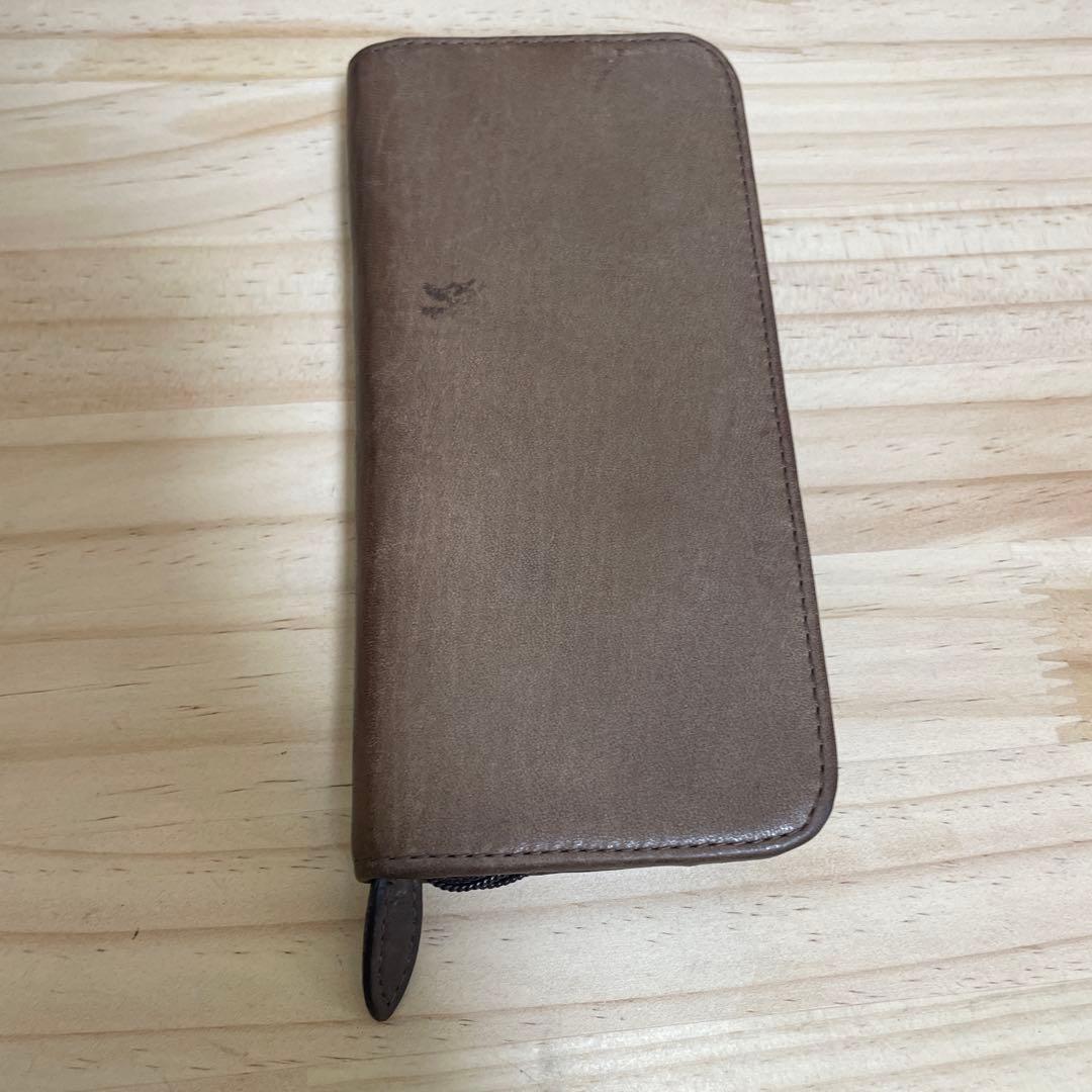 Brown leather Pilot pen case with zipper holding three pens and one pocket