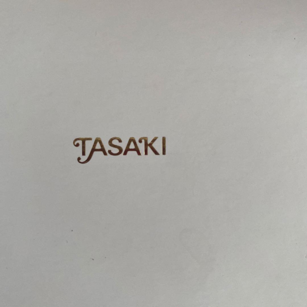 Silver TASAKI freshwater pearl pendant with certificate included on white background