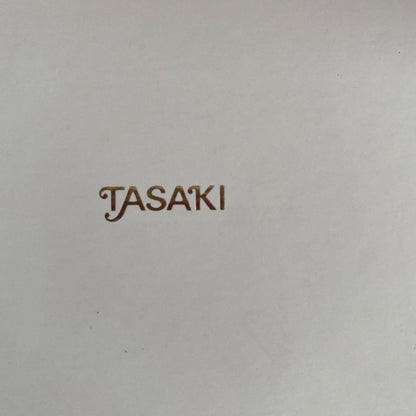 Silver TASAKI freshwater pearl pendant with certificate included on white background