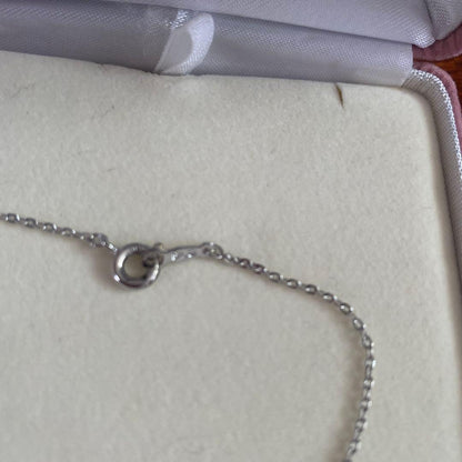 Silver TASAKI freshwater pearl pendant with certificate included on white background