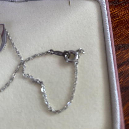 Silver TASAKI freshwater pearl pendant with certificate included on white background