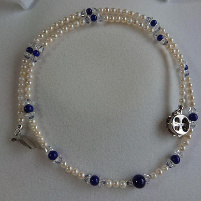 Akoya baby pearl necklace 43 cm with deep blue Lapis Lazuli stones and silver flower-shaped closure
