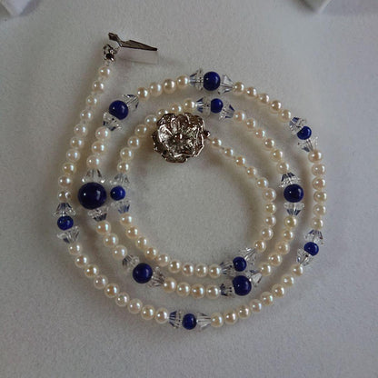 Akoya baby pearl necklace 43 cm with deep blue Lapis Lazuli stones and silver flower-shaped closure