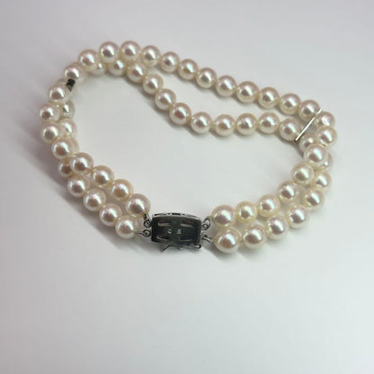 Tasaki silver 2-strand bracelet with approximately 6.0-6.2mm pearls measuring about 19cm