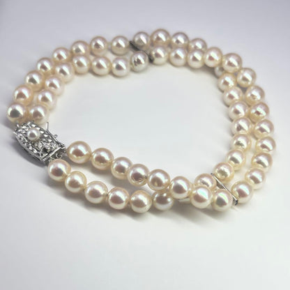 Tasaki silver 2-strand bracelet with approximately 6.0-6.2mm pearls measuring about 19cm