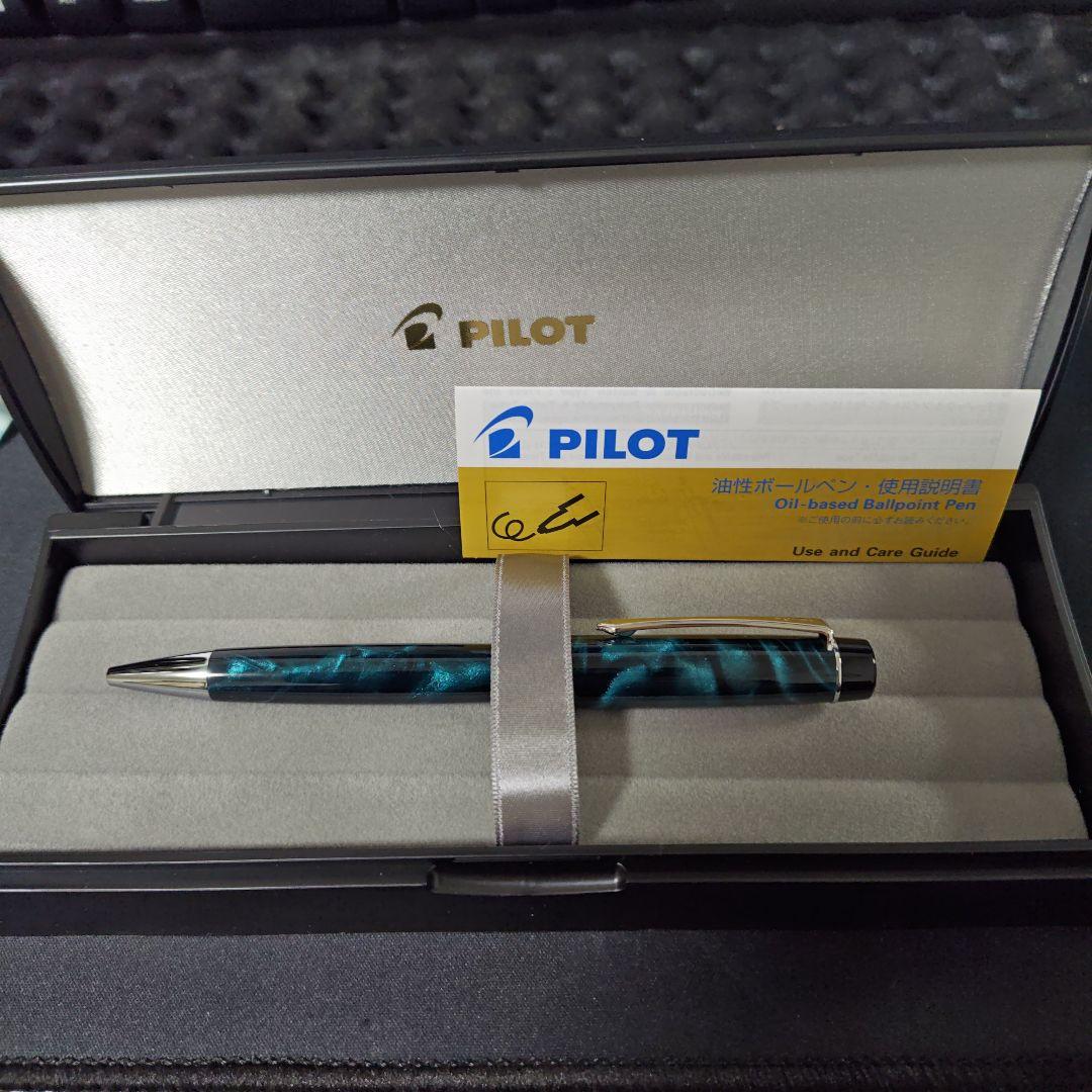 Close-up of a PILOT oil-based ballpoint pen with blue ink and a comfortable grip