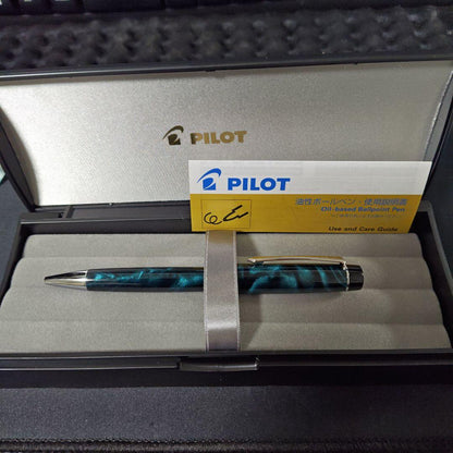 Close-up of a PILOT oil-based ballpoint pen with blue ink and a comfortable grip