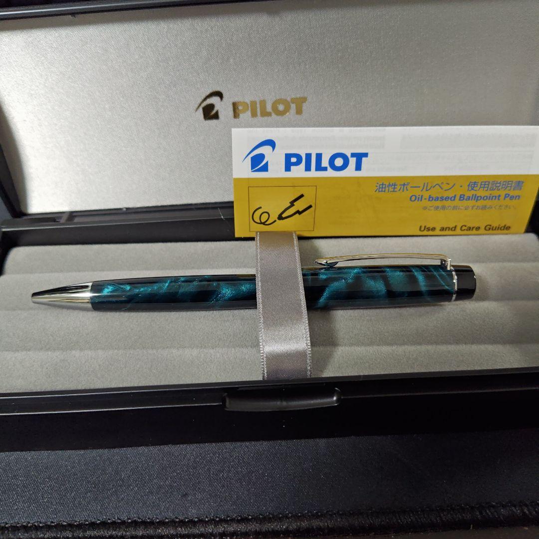 Close-up of a PILOT oil-based ballpoint pen with blue ink and a comfortable grip