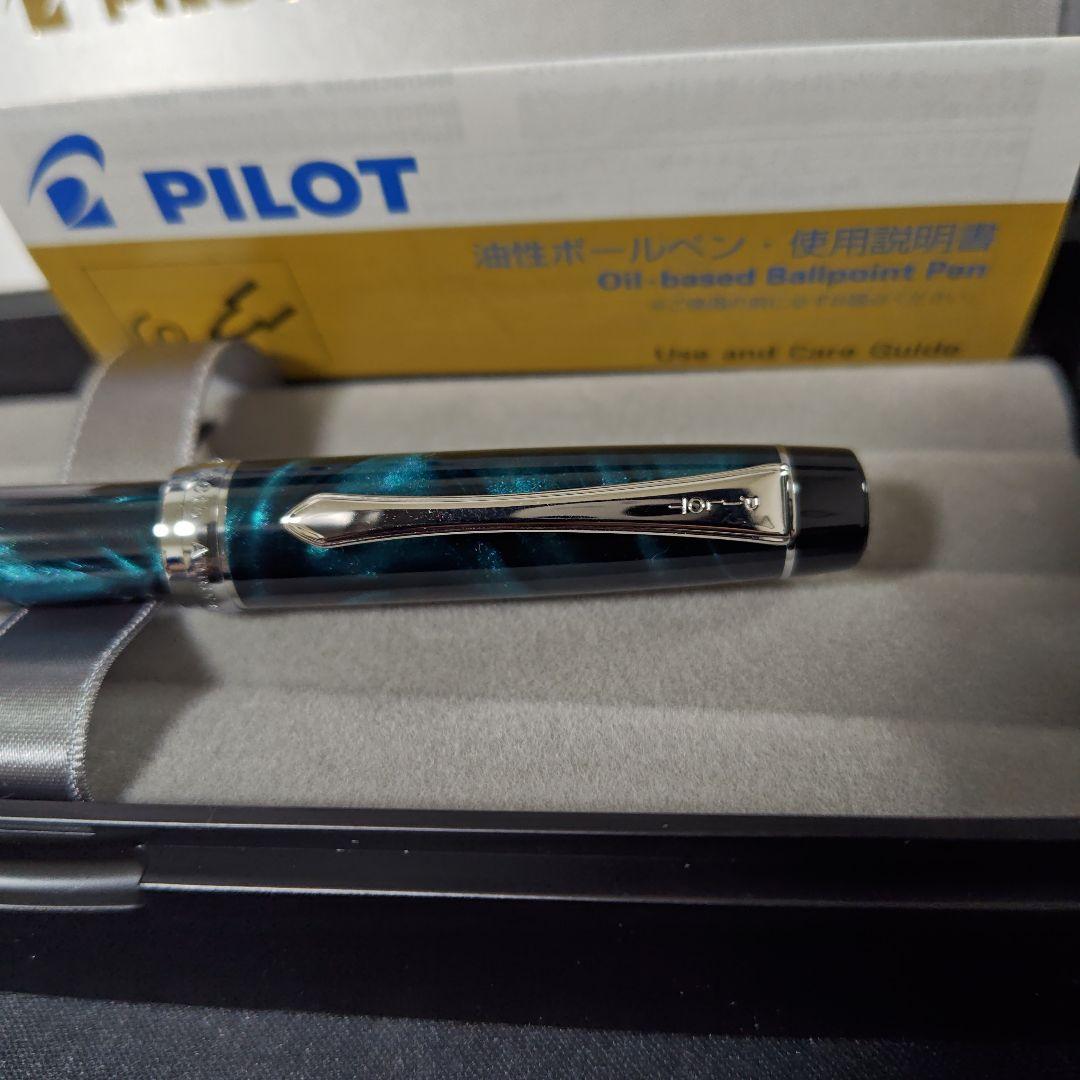 Close-up of a PILOT oil-based ballpoint pen with blue ink and a comfortable grip