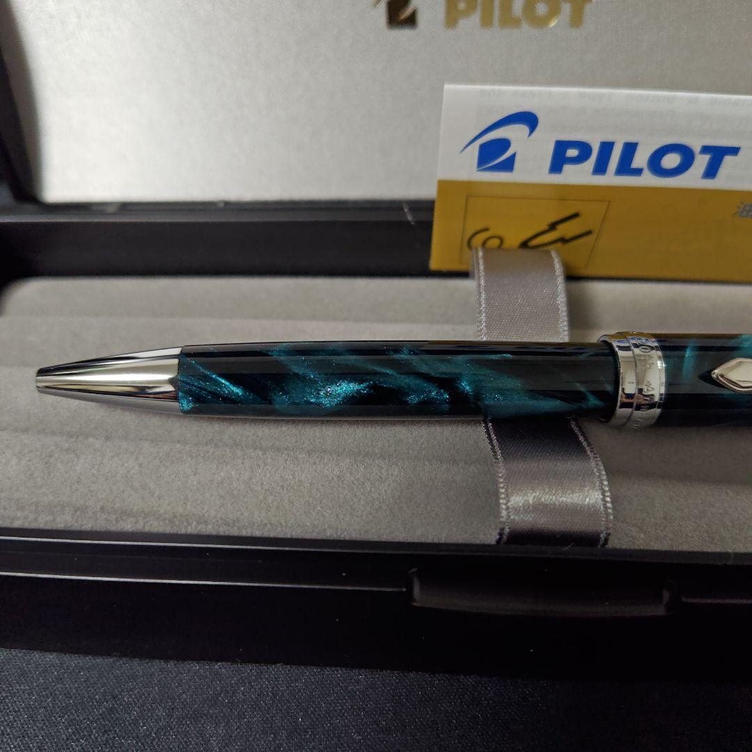 Close-up of a PILOT oil-based ballpoint pen with blue ink and a comfortable grip