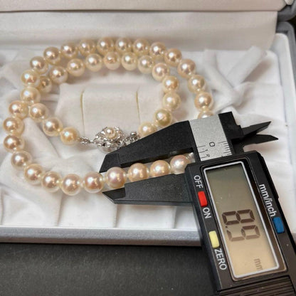 Akoya pearl necklace featuring white pearls sized 8.5mm to 9mm with a silver clasp, 41cm long