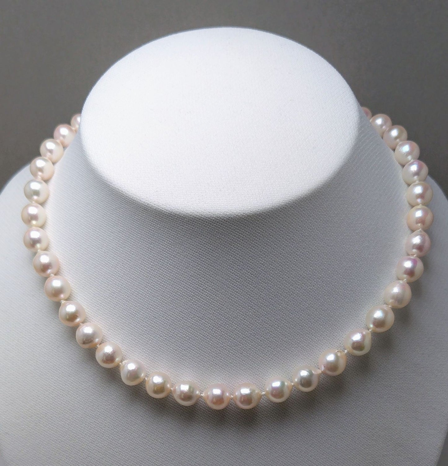 Akoya pearl necklace featuring 9.0-8.5mm white pink semi baroque pearls with unique indentations and good luster