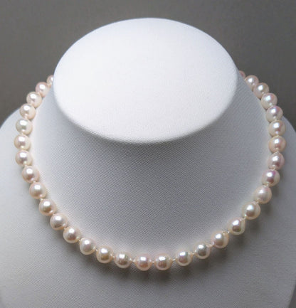 Akoya pearl necklace featuring 9.0-8.5mm white pink semi baroque pearls with unique indentations and good luster