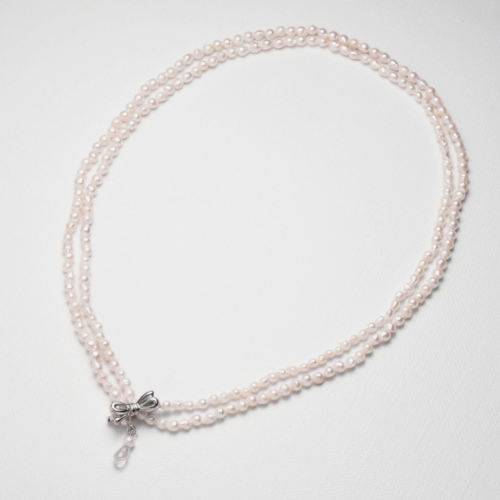 Baroque shape Akoya pearl necklace with 3-3.5mm pearls and rose quartz ribbon clasp, 80cm long