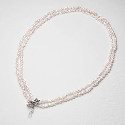 Baroque shape Akoya pearl necklace with 3-3.5mm pearls and rose quartz ribbon clasp, 80cm long