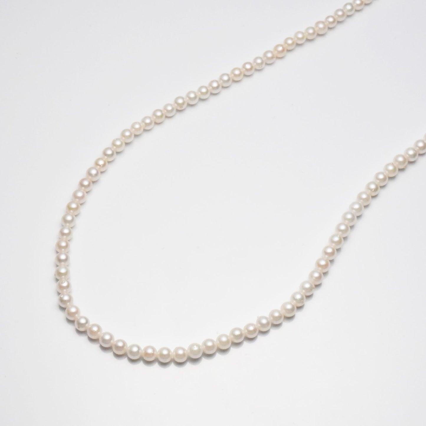 Pt850 Akoya pearl necklace featuring 3-3.5mm pearls and a 42cm strand with platinum clasp