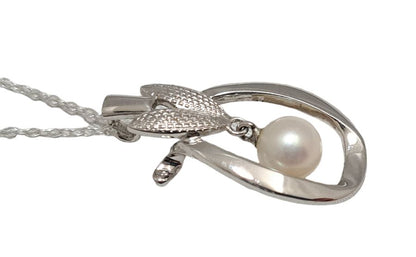 Mikimoto pearl pendant head with 6.5mm pearl on SV925 silver setting measuring 1.5x3 cm displayed on white background