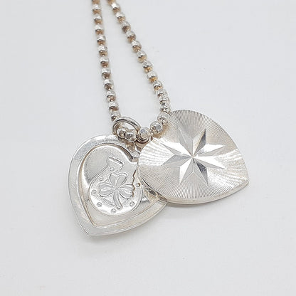 Agete heart-shaped silver necklace with heart rocket and clover charm on silver chain