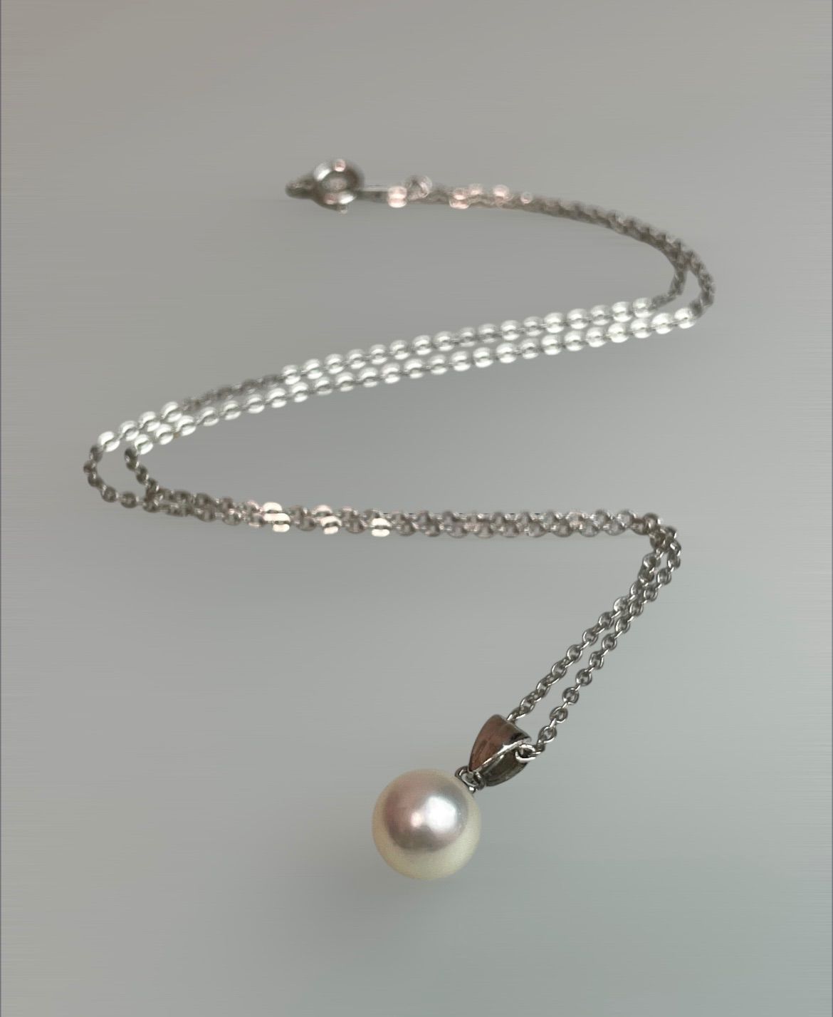 Akoya pearl necklace with a single 8.5mm white pearl on a silver chain