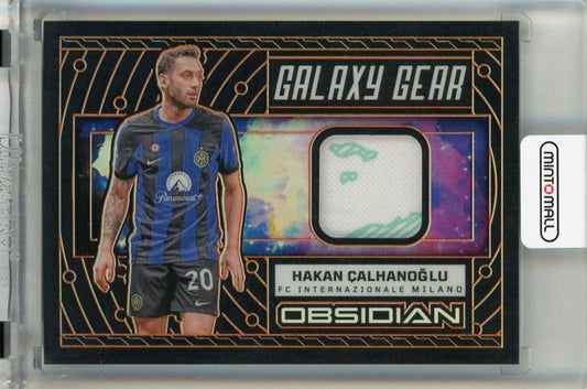2023-24 Panini Obsidian Hakan Calhanoglu Galaxy Gear Electric Etch Orange trading card serial #1368 of 99