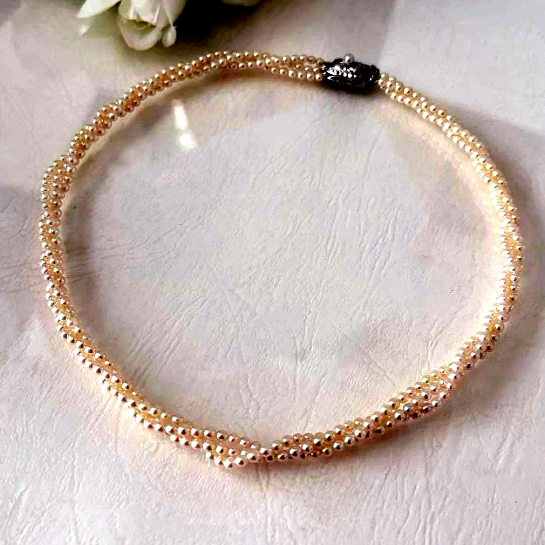 428 Tasaki silver necklace with three rows of approximately 2.7-2.9mm pearls and silver clasp