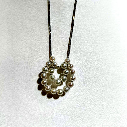 Akwoya Pearl Horseshoe Pendant Necklace with two horseshoe charms and small pearls on a 50cm chain