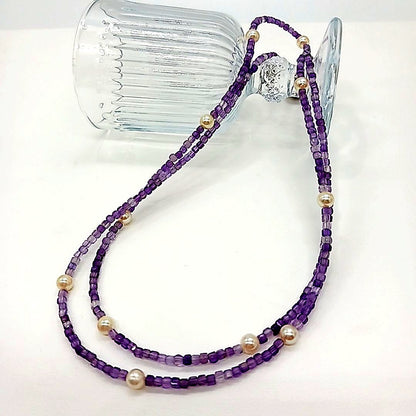 Akoya baby pearl and amethyst necklace with cream pearls and silver chain approximately 73 centimeters long