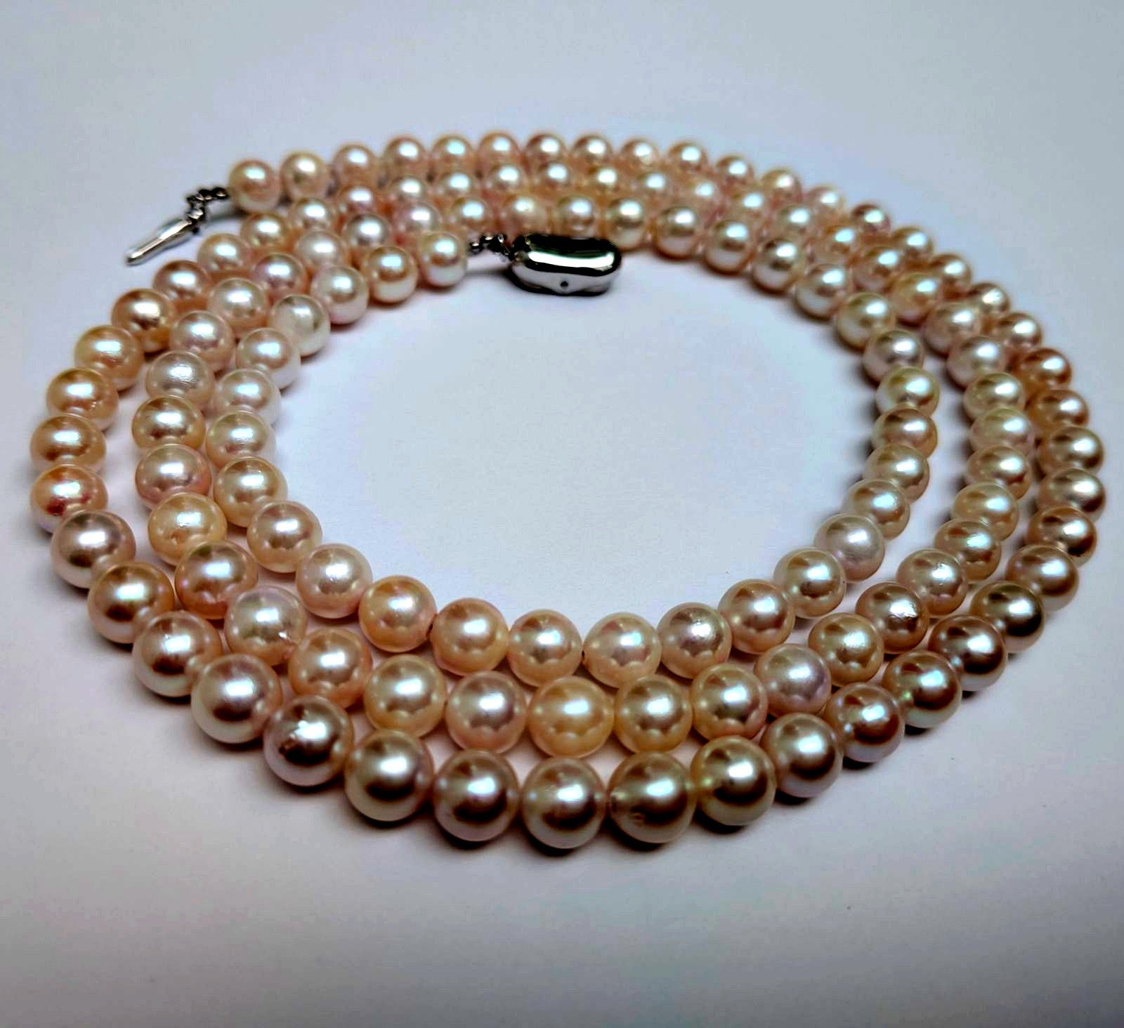 Long Akoya pearl necklace with round 6.5-7mm pink tone pearls and silver clasp, 82 cm length