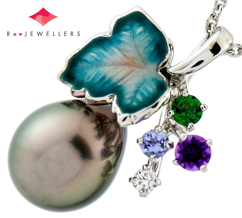 Mikimoto pendant necklace with drop-shaped black South Sea pearl and botanical motif in 18K white gold