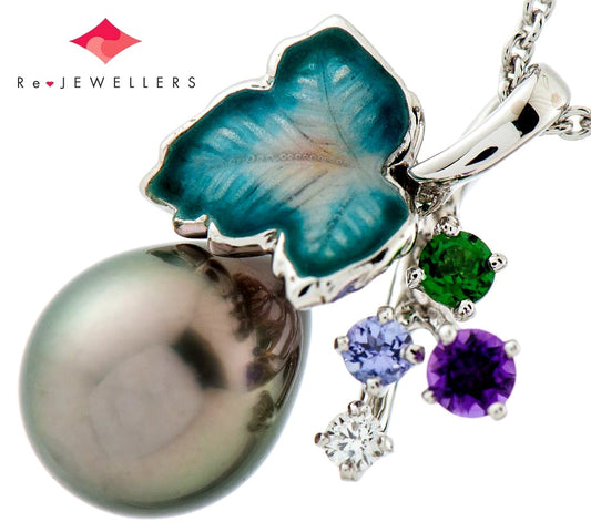 Mikimoto pendant necklace with drop-shaped black South Sea pearl and botanical motif in 18K white gold
