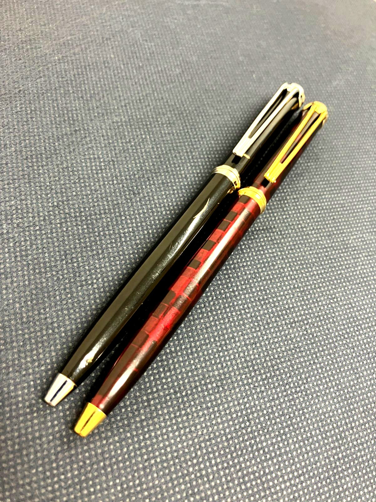 Waterman Harmonie ballpoint pen set with black twist pen and red marble twist pen, both 135mm long