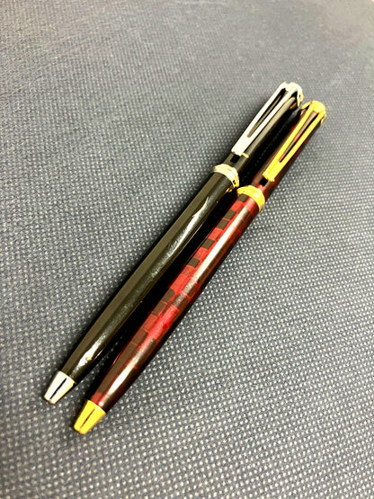 Waterman Harmonie ballpoint pen set with black twist pen and red marble twist pen, both 135mm long