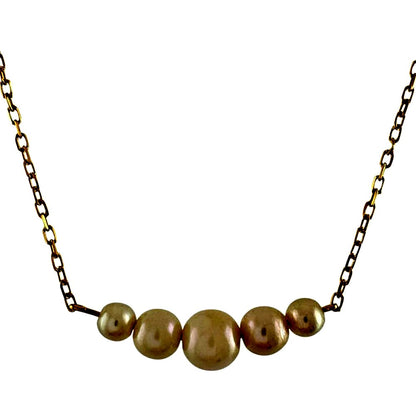 Mikimoto 18K yellow gold pearl necklace for ladies weighing 2.3 grams shown on white background