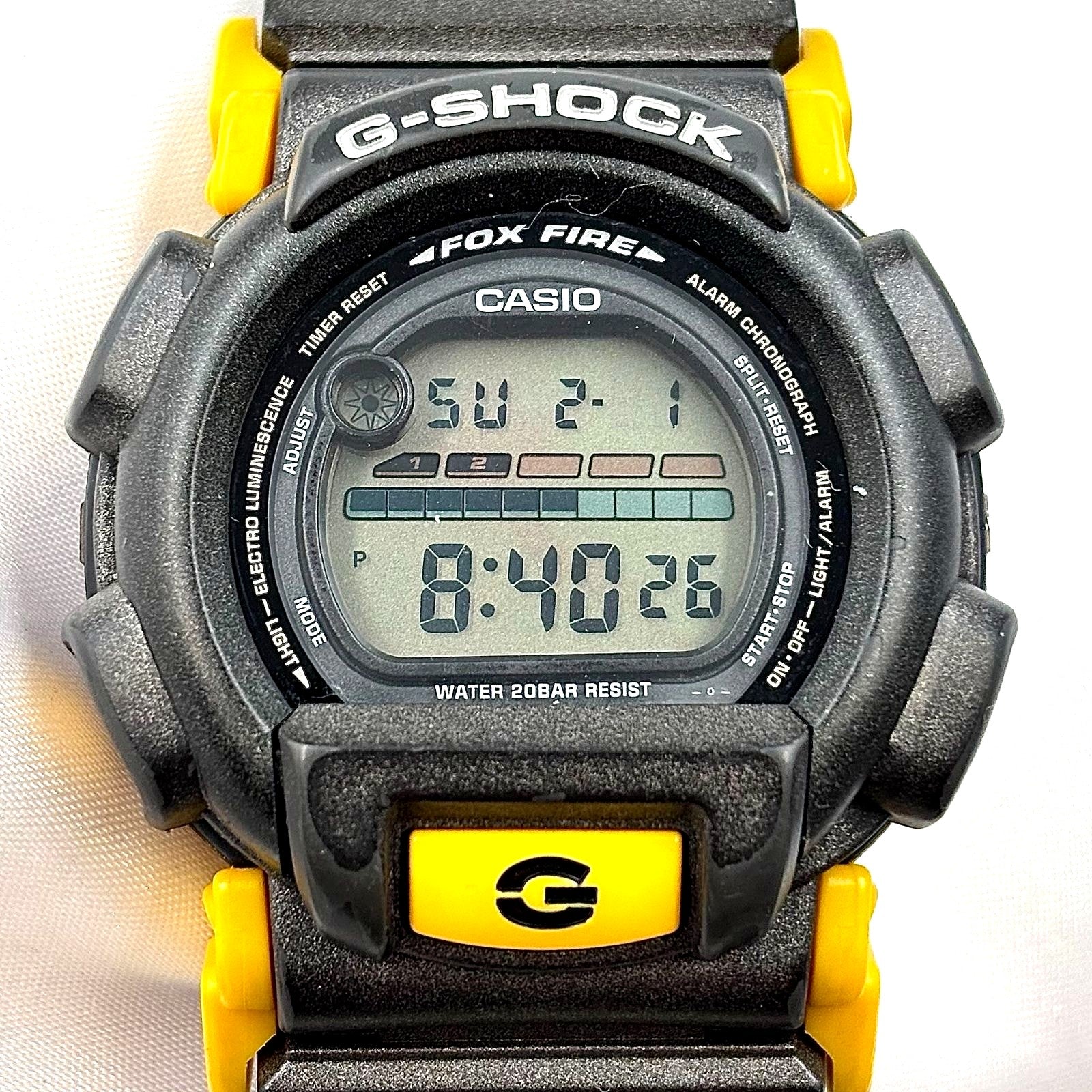 Casio G-Shock DW-003 men's digital quartz watch in yellow and black with water resistant and shockproof features