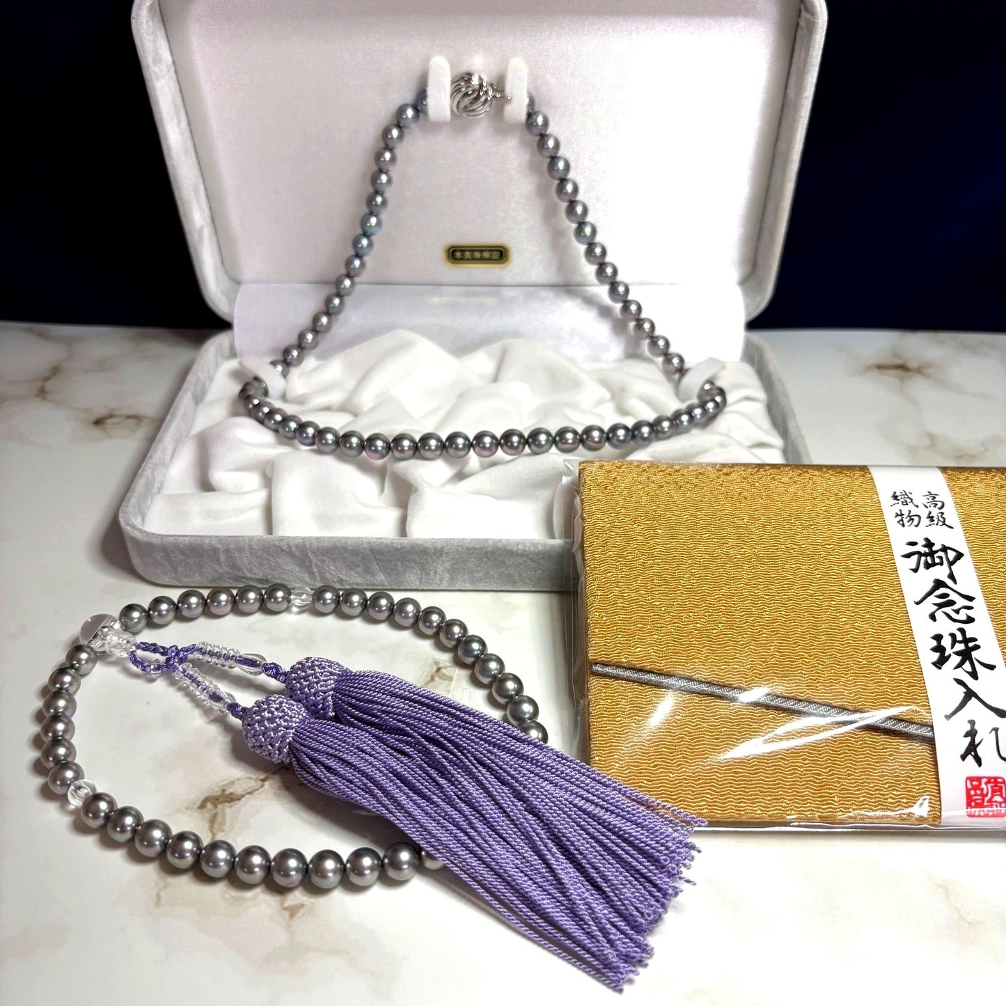 Akoya genuine pearl necklace in gray with mixed navy and purple tones, paired with silk Juzu bracelet