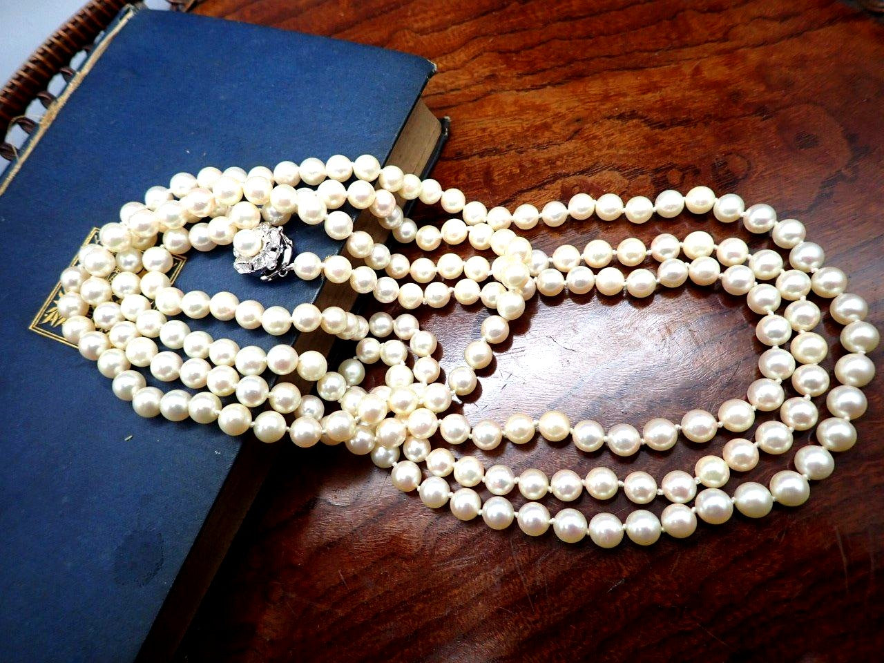 Yamato Akoya pearl necklace 160 cm length with silver clasp displayed on white background