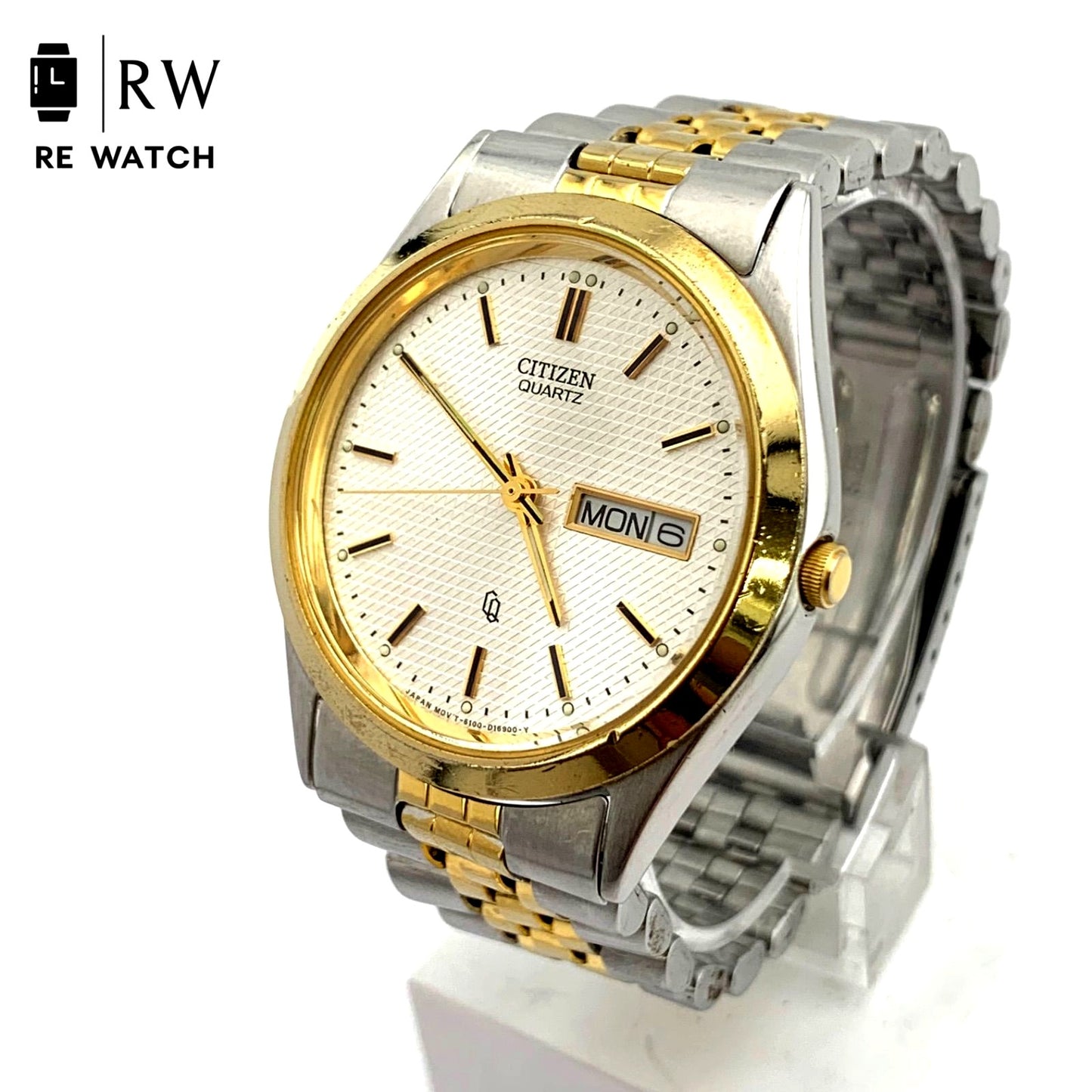 Used CITIZEN 6100 Quartz wristwatch in silver and gold with stainless steel band and date display