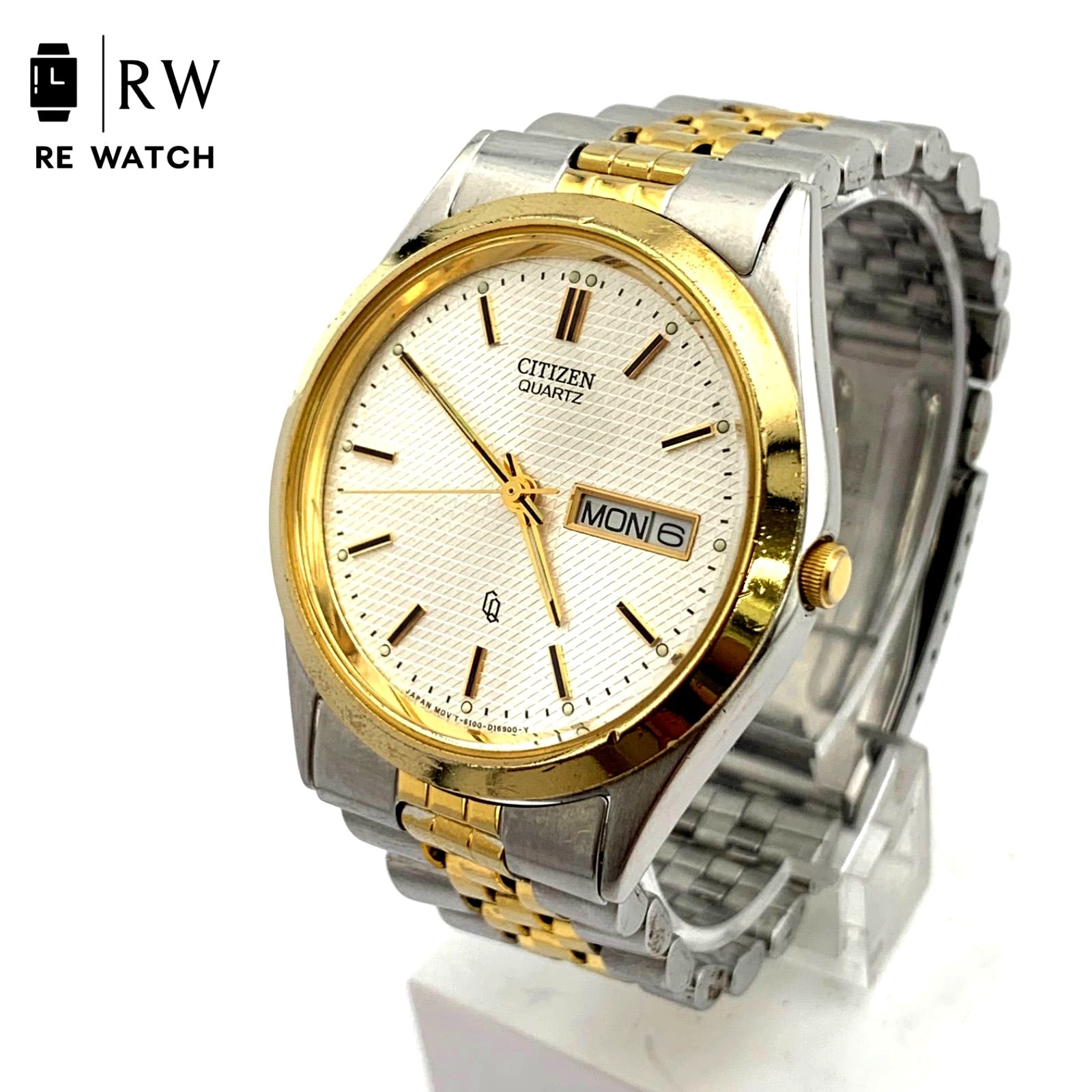 Used CITIZEN 6100 Quartz wristwatch in silver and gold with stainless steel band and date display