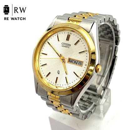 Used CITIZEN 6100 Quartz wristwatch in silver and gold with stainless steel band and date display