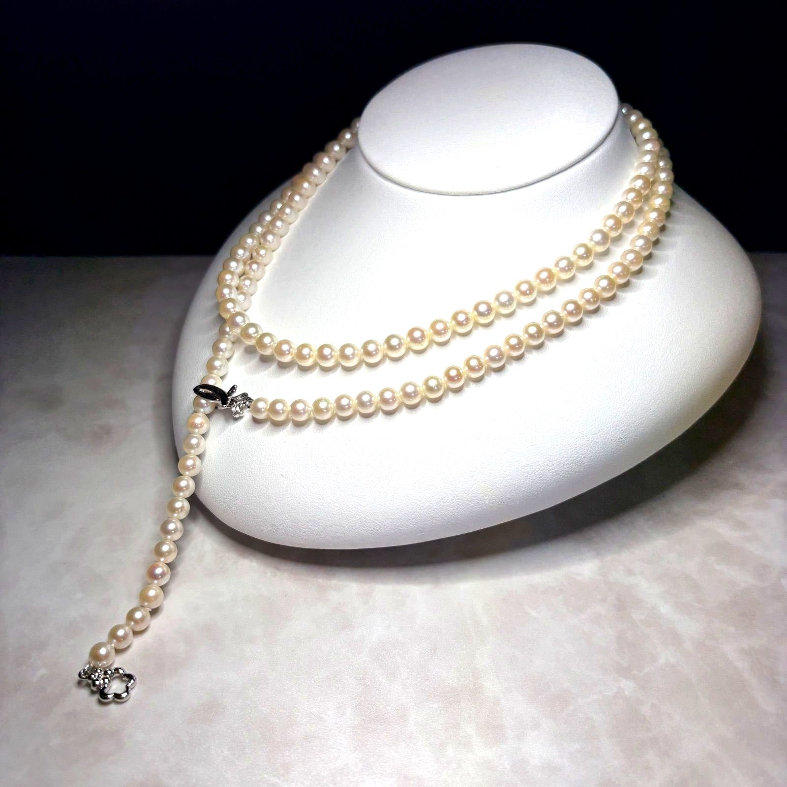 Akoya genuine pearl necklace 82 cm long with 5.5-6.0mm ivory pearls and silver clip fittings showing slight wear