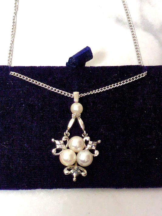 Close-up of a Mikimoto Pearl Necklace featuring lustrous genuine pearls on a delicate string