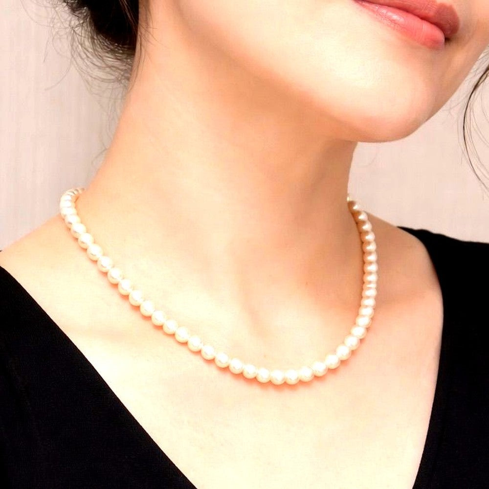 Akoya pearl necklace with 6mm real pearls and silver clasp displayed on a white background
